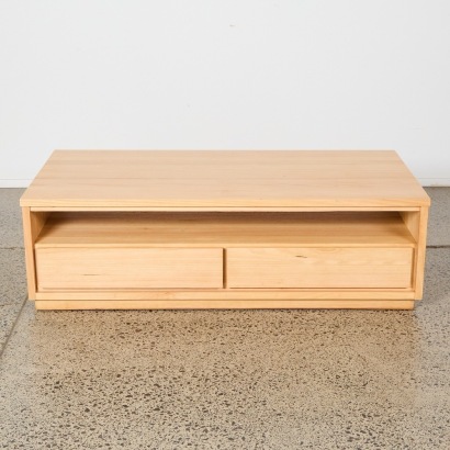 A Wooden Coffee Table With Two Drawers