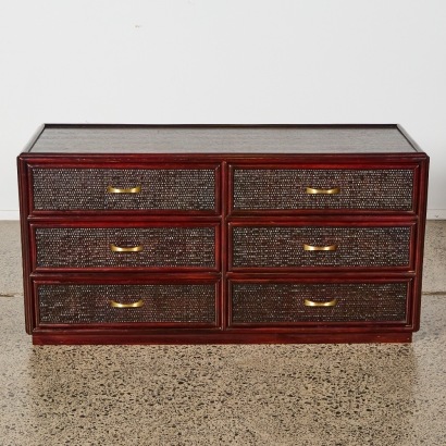 An Italian Bordeaux Rattan Dresser With Brass Pulls