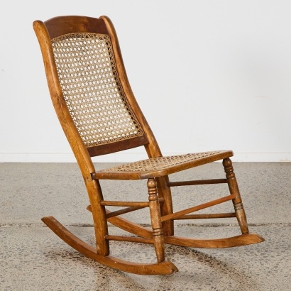 An Antique Rattan Rocking Chair