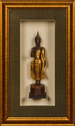 A Framed and Boxed Wooden Buddha Ornament
