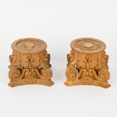 A Pair of Wooden Capital Candle Holders