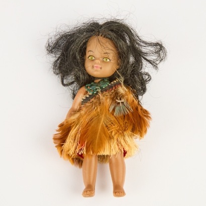 A vintage Maori souvenir Doll with Hei Tiki and Cloak