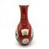 A Chinese Red Ground Famille Rose Vase decorated with panels - 2