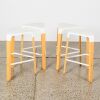 A Set of Four White Picapau Stools by Infiniti Design