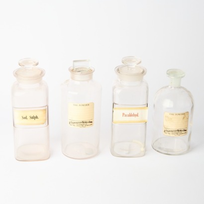 A Collection of Four Vintage Apothecary Bottles
