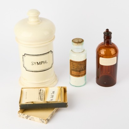 A Vintage Symphoricarpos Apothecary Jar and a Pair of Apothecary Bottles and Labels