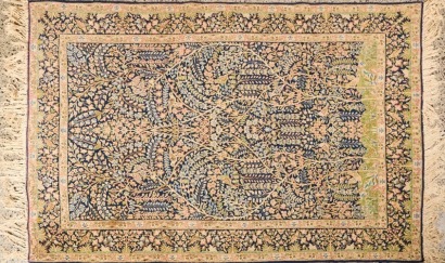 A Pictorial Carpet with Scenes of Vines and Birds