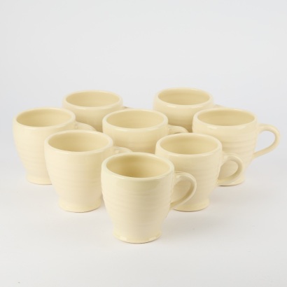 A Set of Eight Tony Sly Coffee Cups