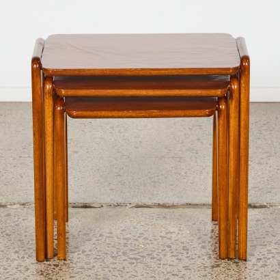 A Trio of Mid Century Scissor Legged Nest of Tables