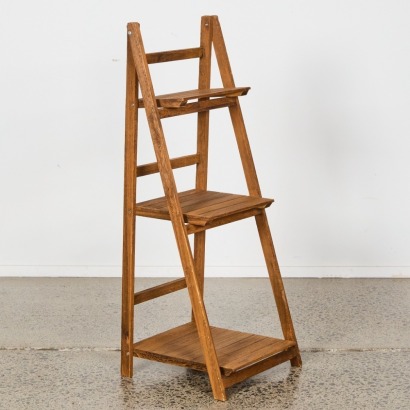 A Folding Three Tiered Storage Shelf