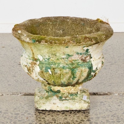 A Mossy Concrete Urn Planter