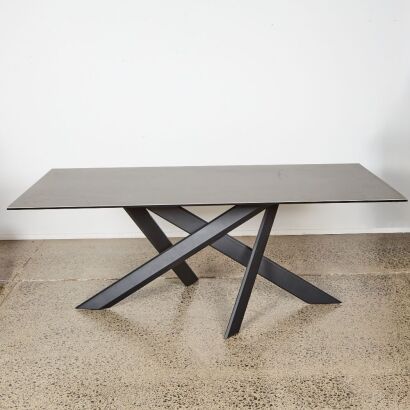 A Contemporary Ceramic Topped Table With A Geometric Base
