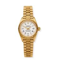 A Lady's gold Datejust wristwatch, Rolex, circa 1996. Automatic. 26mm. Ref: 69278. Serial number T351436. White dial with applied diamond indexes and black printed Roman numerals, tree bark bezel, centre sweep seconds, date aperture at 3 o'clock. Case, di