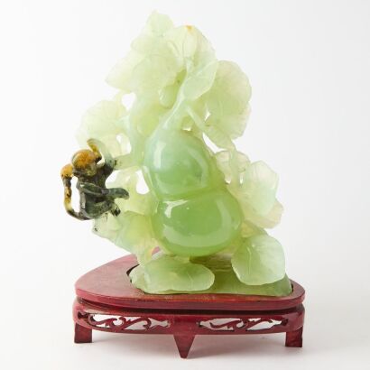 A Chinese Green Jade Carving of Monkey with Fruits and Vegetables