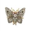 A Victorian diamond butterfly brooch, set throughout with old brilliant and rose cut diamonds. Silver and yellow gold. Weight 6.67 grams. Width 28mm. Length 25mm.