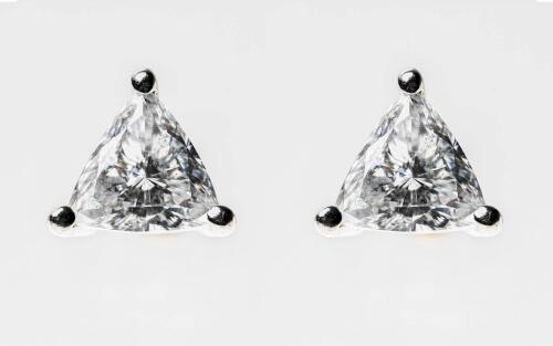 A pair of diamond earrings, the trilliant cut diamonds of estimated weights 0.54 carat and 0.55 carat. 18ct yellow and white gold. Weight 2.46 grams. Threaded post and butterfly attachments. 