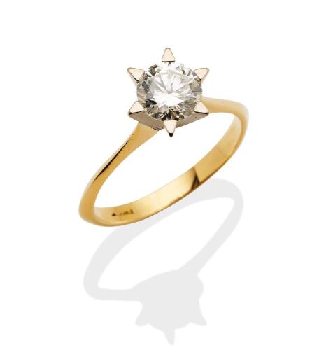 A 1.12 carat solitaire diamond ring, six claw set with a modern brilliant cut diamond of estimated weight. 18ct yellow gold. Weight 3.6 grams. Size Q. Gemmologists report available&nbsp;