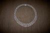 A diamond collar, of fringed design, the triple row front section of the articulated necklace graduating to a double row of bezel set diamonds. Estimated diamond weight 17.55 carats. 18ct white gold. Weight 82 grams. Length 40cm.