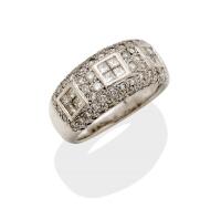 A diamond band ring, the front section of the tapered band set with three square princess cut diamond sections in a pave diamond set surround. Estimated total diamond weight 1.84 carats. Platinum. Weight 15.3 grams. Size O. Gemmologists report available.