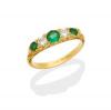 A Victorian style emerald and diamond bridge ring, set with three emeralds and two brilliant cut diamonds. 18ct yellow gold.  Weight 2.7 grams. Size M.