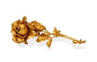 An Italian gold flower brooch, modelled as along stemmed rose, matt finish. 18ct yellow gold. Weight 16.71 grams. Length 8.5cm.