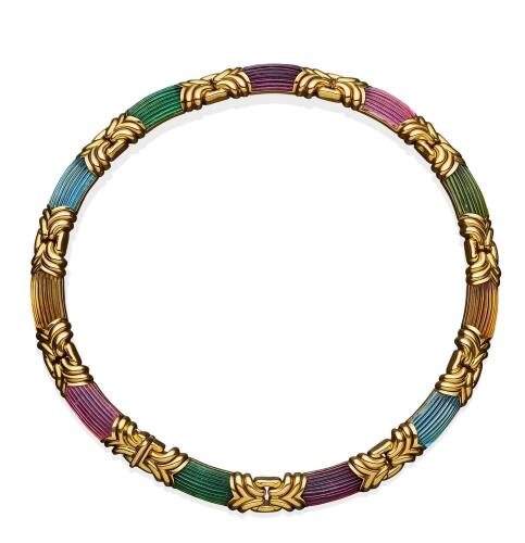 A gold and gemstone Primavera necklace, Bulgari, circa 1980's. The interlocking gold motifs with alternating domed and fluted aquamarine, citrine, tourmaline and peridot sections. 18ct yellow gold. Weight 166.4 grams. Inner circumference 40cm. Signed Bulg