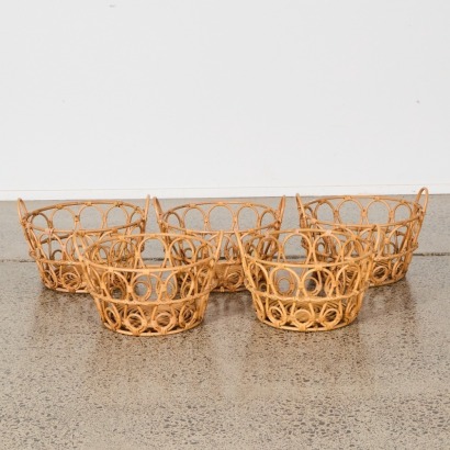 A Set of Five Cane Storage Baskets with Handles
