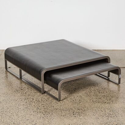 A Pair of Contemporary Leather And Curved Metal Frame Coffee Tables