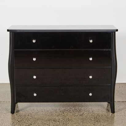 A French Provincial Inspired Black Glass Four-Drawer Dresser
