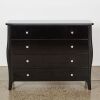A French Provincial Inspired Black Glass Four-Drawer Dresser