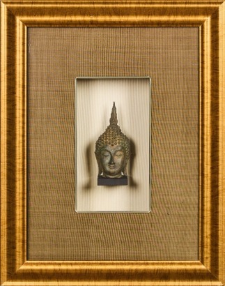 A Framed and Boxed Brass Buddha Head Ornament
