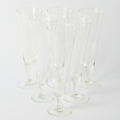 A Set of Six Etched Champagne Glasses