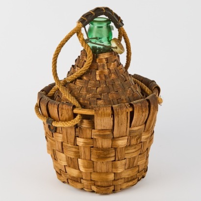 A Vintage Demijohn Woven Wicker Bottle