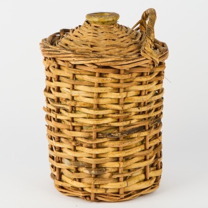 A Vintage Crock With a Woven Wicker Cover