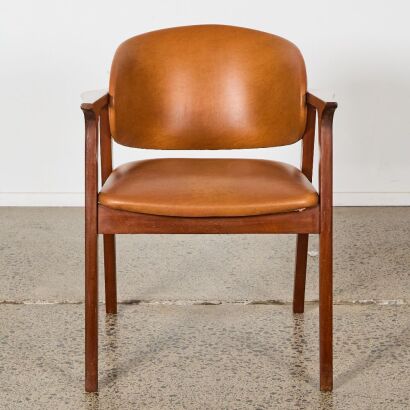 A Mid-Century Wood and Vinyl Chair