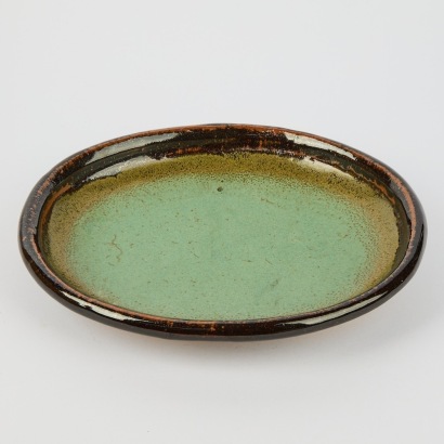 A Don Thornley Oval Platter In A Tenmoku And Chun Glaze