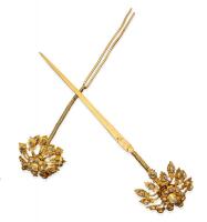 Two antique Malaysian silver gilt and paste hairpins. Length 16cm.