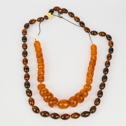 A Pair of Chunky Costume Necklaces Amber And Torti Resin Beads