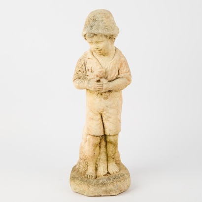 A Vintage Concrete Statue of A Boy Holding A Dove