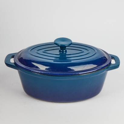 A Large Oval Cast Iron Casserolle Dish In Blue