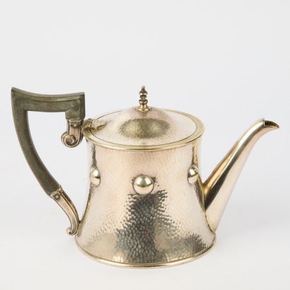 An Arts & Crafts Hand-Hammered Teapot, United Kingdom