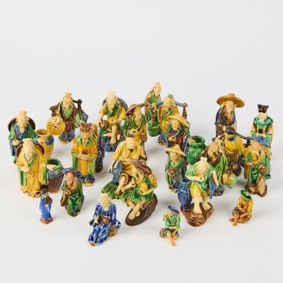 A Group of Twenty-four Early to Mid-20th Century Chinese Foshan Pottery Figures