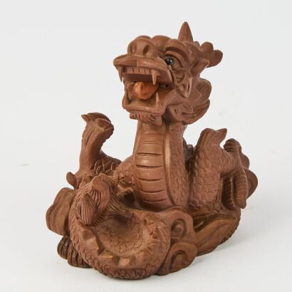 A Chinese 20th Century Purple Clay Dragon Ornament