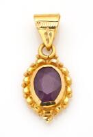 An Indian ruby pendant. 21ct yellow gold. Weight 3.69 grams. Length 30mm.