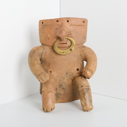 A Quimbaya Pottery Seated Slab Figure, Colombia