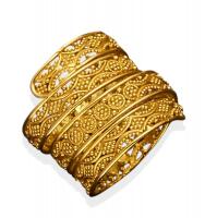 A gold ring, of pierced spiral design. 22ct yellow gold. Weight 8 grams.