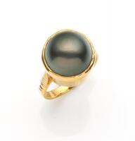 A Tahitian pearl ring, the 12.28mm pearl in a bezel setting. 21ct yellow gold. Weight 7.02 grams. Size L.