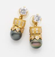 A pair of Tahitian pearl and clearstone drop earrings. 21ct yellow gold. Weight 14.67 grams. Threaded post attachments.