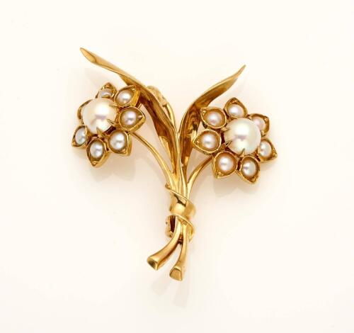 A pearl flower brooch, of spray design, the two flowerheads set with pearls. 9ct rose gold. Weight 5.76 grams. Length 4cm. 