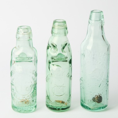 A Collection of Three Vintage Soda Bottles